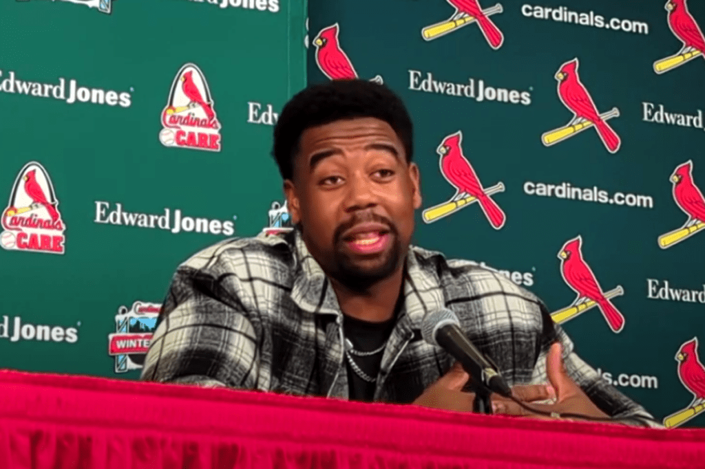 Jordan Walker of the St. Louis Cardinals speaking at a press conference, addressing media questions with a team-branded backdrop.