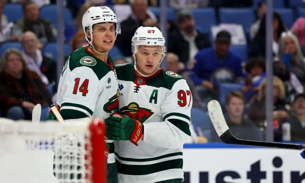 The image depicts Minnesota Wild's star forward, Kirill Kaprizov, in action on the ice during a game.