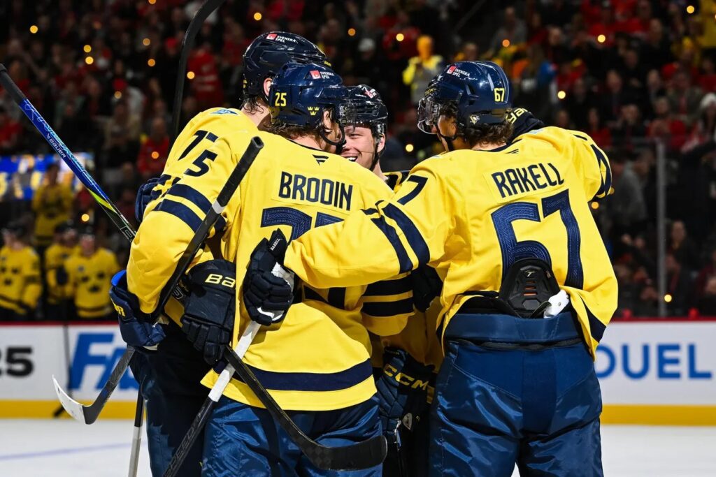 Team Sweden celebrates a second period goal against Team Canada.