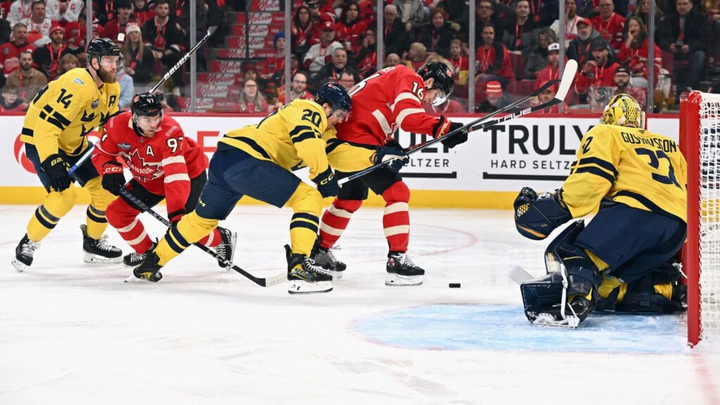 Sweden battles off Team Canada in the third period.