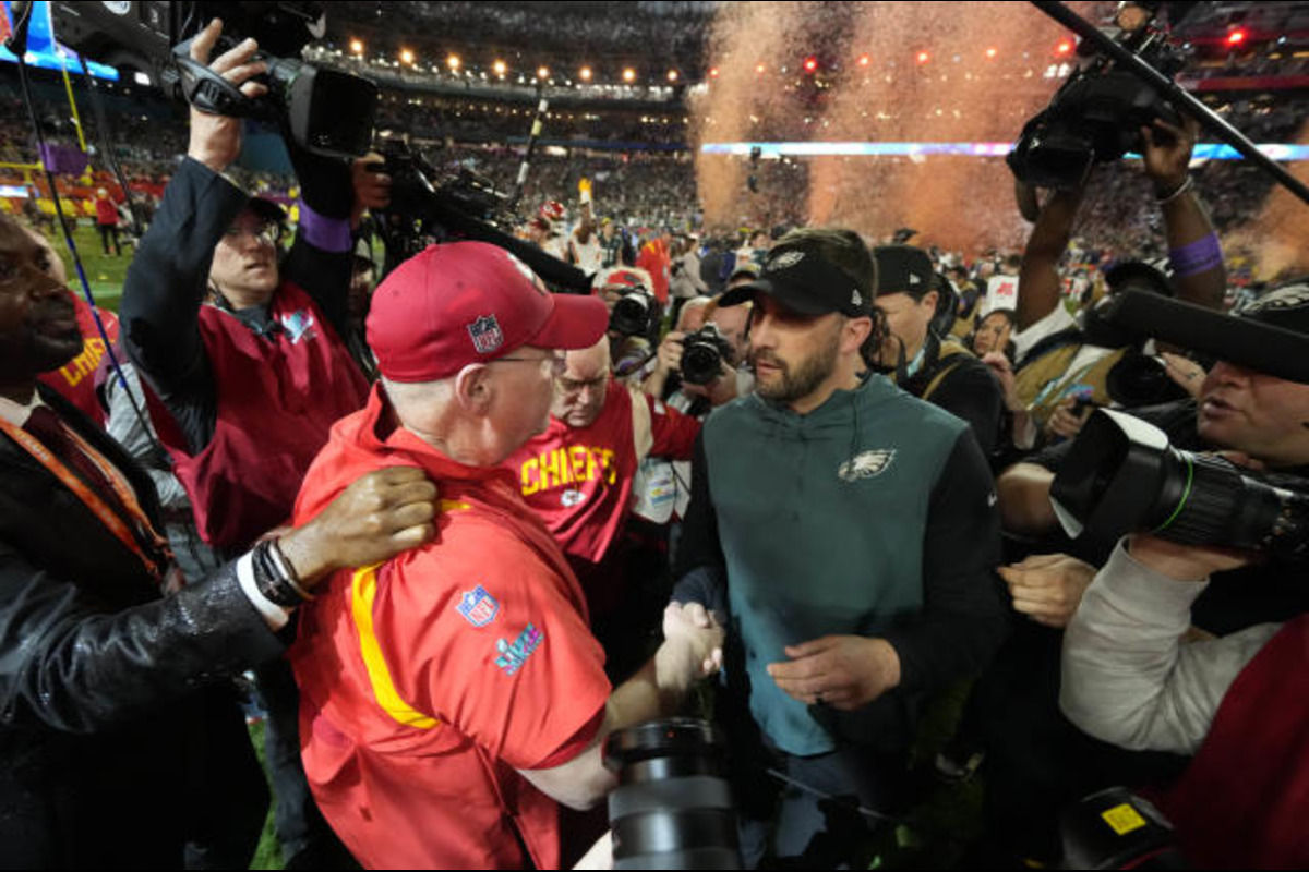 Andy Reid and Nick Sirianni embrace each other after Super Bowl 57